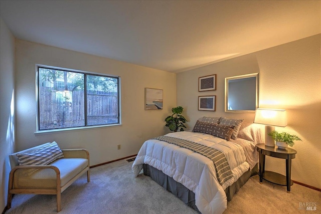 bedroom with light carpet