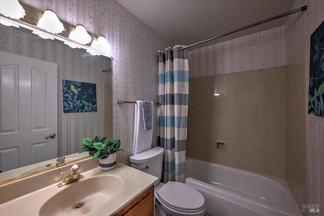 full bathroom featuring vanity, shower / tub combo, a textured ceiling, and toilet