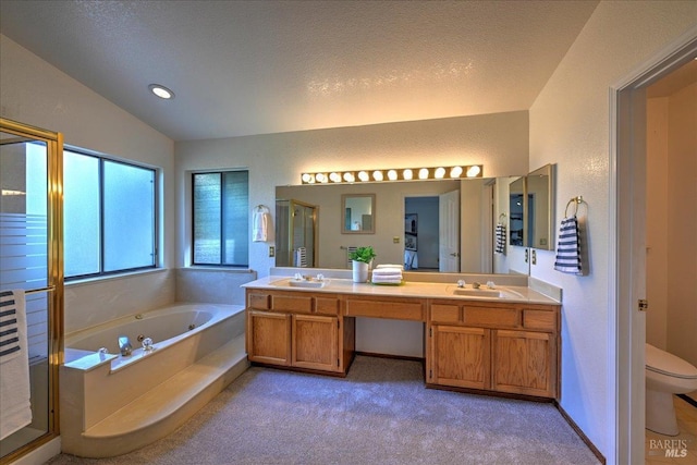 full bathroom featuring a textured ceiling, shower with separate bathtub, vaulted ceiling, toilet, and vanity