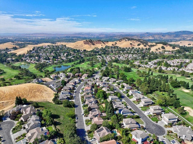 birds eye view of property featuring a water and mountain view