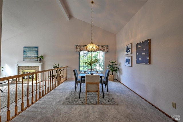 dining space featuring beamed ceiling, carpet flooring, high vaulted ceiling, and a brick fireplace