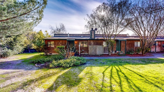 ranch-style house with a front lawn