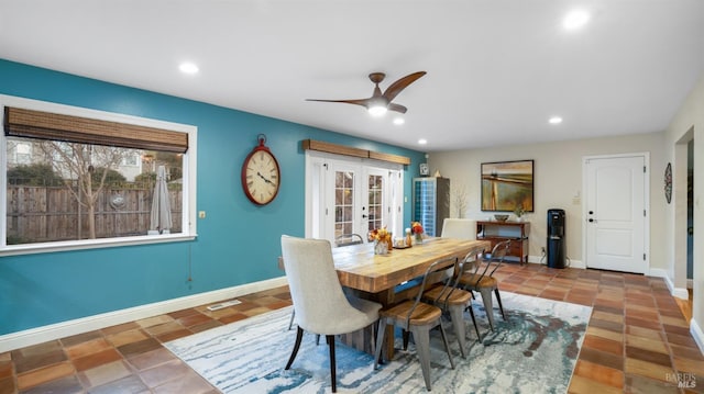 dining space featuring ceiling fan and french doors