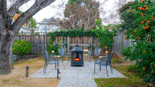 view of patio with an outdoor fire pit