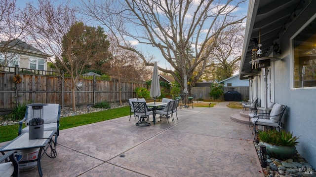 view of patio / terrace featuring a fenced backyard and outdoor dining area