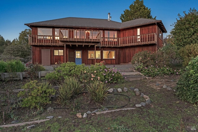 back of property featuring a deck