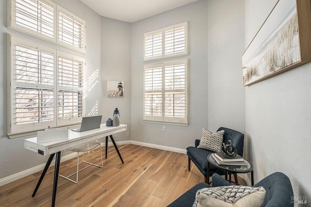 office space with light hardwood / wood-style floors