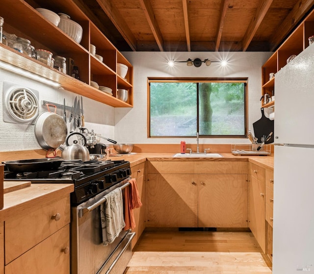 kitchen with light hardwood / wood-style flooring, beamed ceiling, white fridge, high end range, and wood ceiling