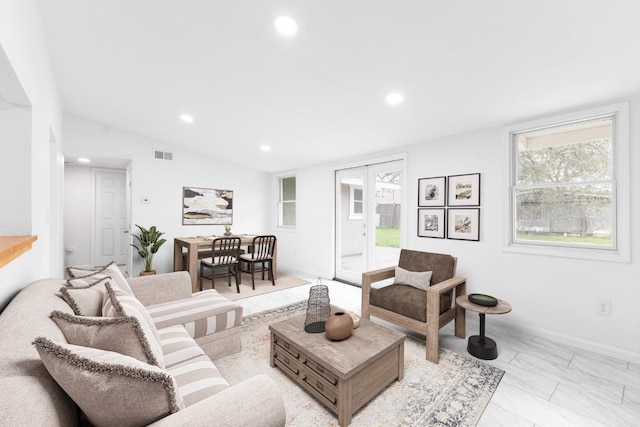 living area featuring vaulted ceiling, visible vents, and recessed lighting