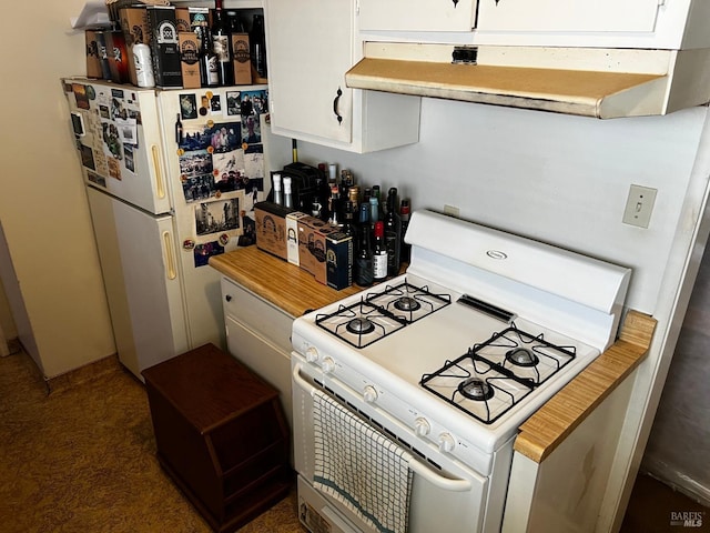 kitchen featuring extractor fan, white appliances, and white cabinetry