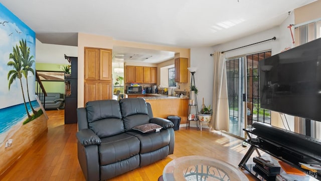 living room with light hardwood / wood-style flooring