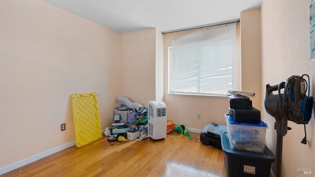 miscellaneous room featuring wood-type flooring