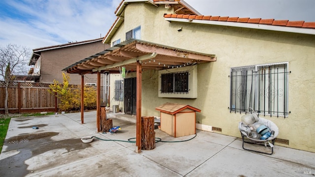 back of house with a patio