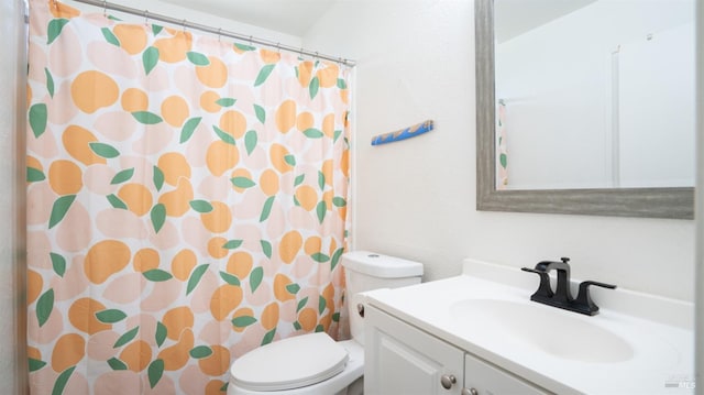 bathroom featuring vanity, toilet, and walk in shower