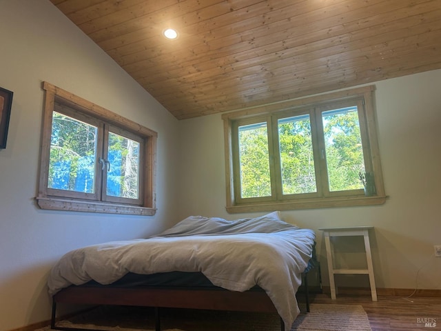 bedroom with wood ceiling, vaulted ceiling, and wood-type flooring