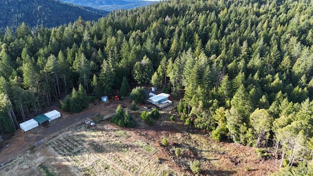 34620 Eureka Hill Rd, Point Arena, CA 95468 - view of property location with a heavily wooded area and a mountain backdrop