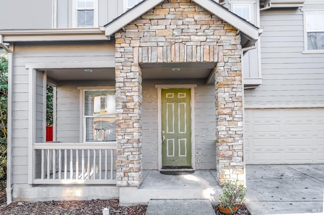 doorway to property featuring a garage