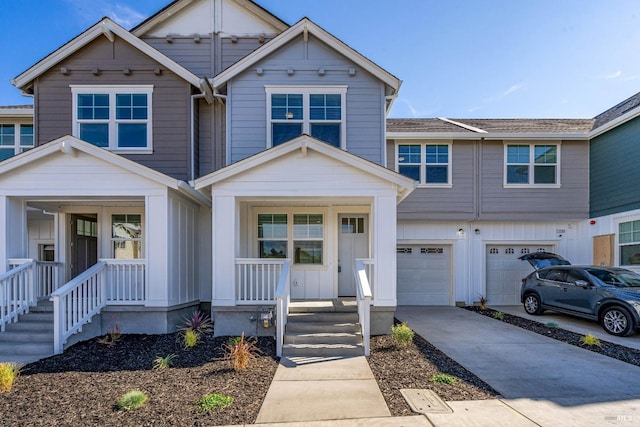 view of front of home featuring covered porch and a garage