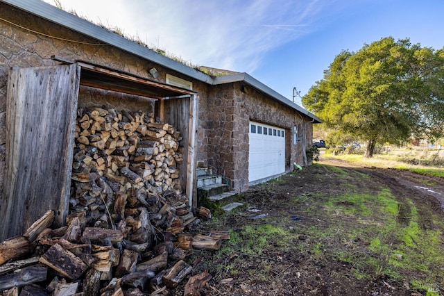 view of side of home with a garage