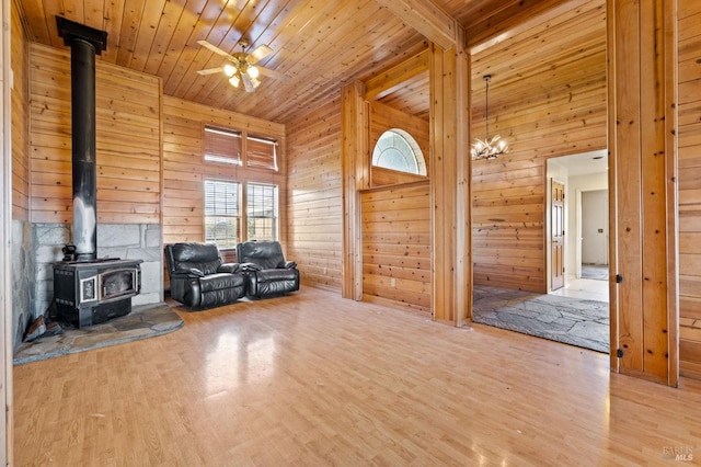 unfurnished room with hardwood / wood-style flooring, wood walls, and wood ceiling