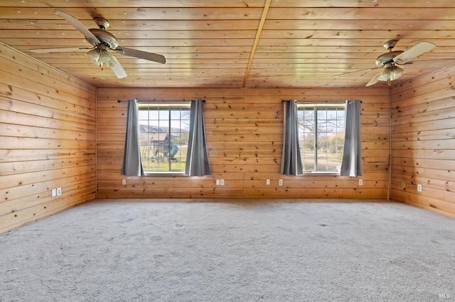 unfurnished room with carpet floors and wood ceiling