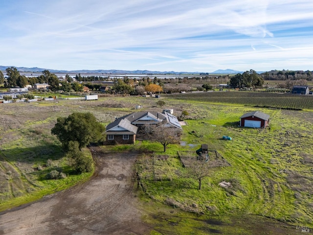 drone / aerial view with a mountain view and a rural view