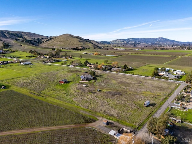 bird's eye view featuring a mountain view and a rural view