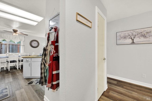 corridor with wood-type flooring