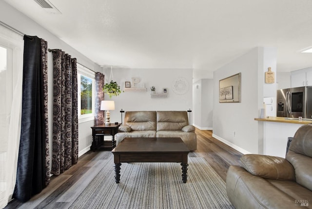 living room with dark wood-type flooring