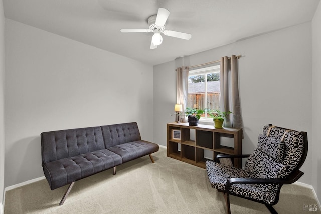 sitting room featuring ceiling fan and carpet floors