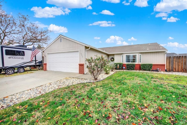 ranch-style house with a garage and a front yard