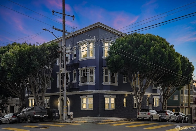 view of outdoor building at dusk