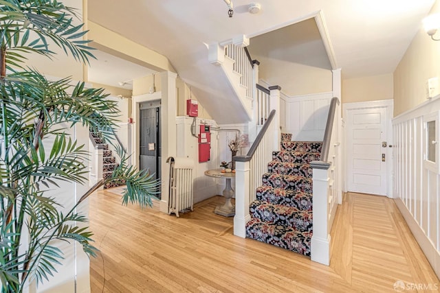 stairs featuring hardwood / wood-style flooring