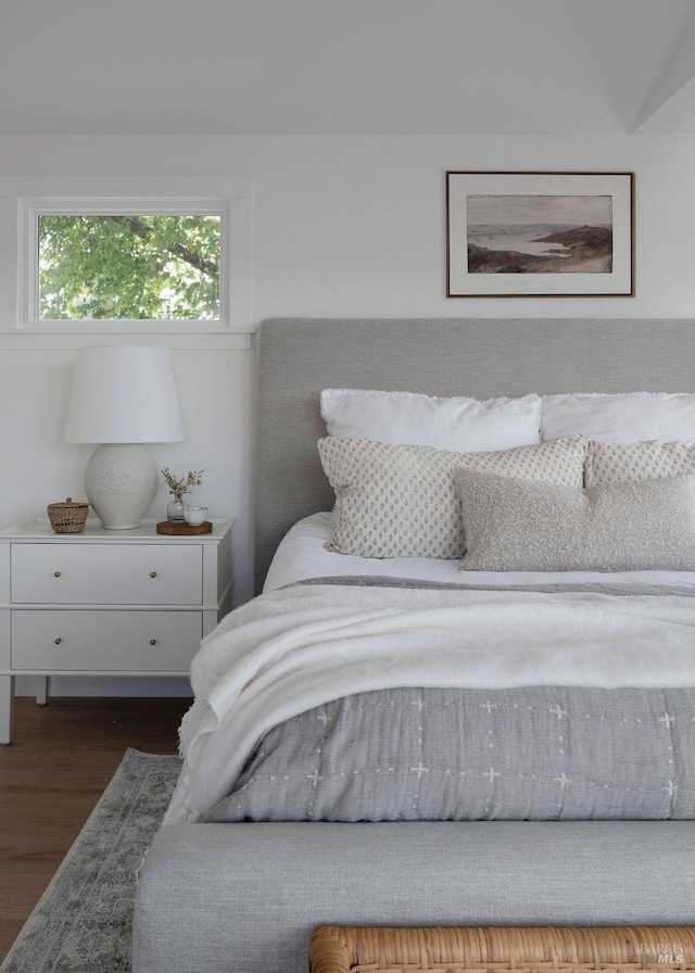 bedroom with dark wood-type flooring