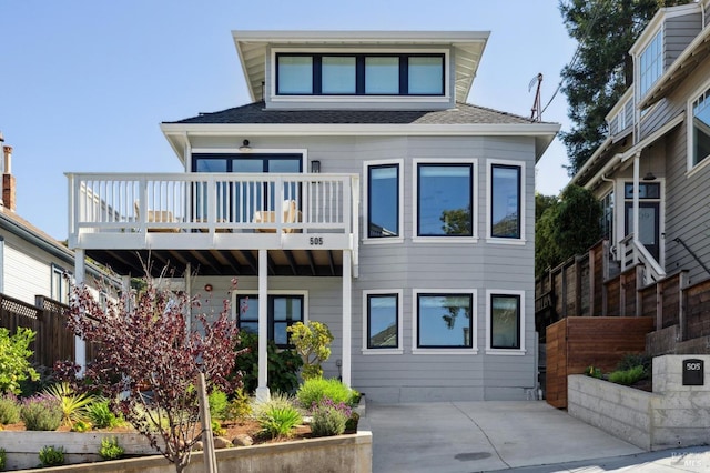 view of front of property with a balcony