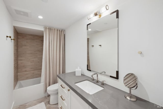 full bathroom featuring toilet, vanity, and shower / bathtub combination with curtain