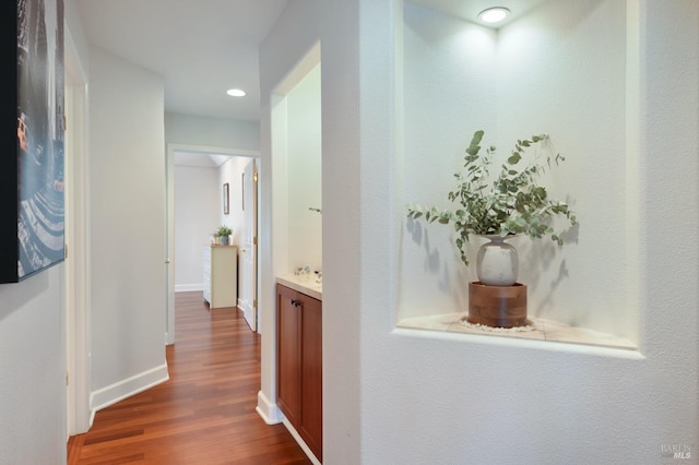 hallway featuring hardwood / wood-style flooring