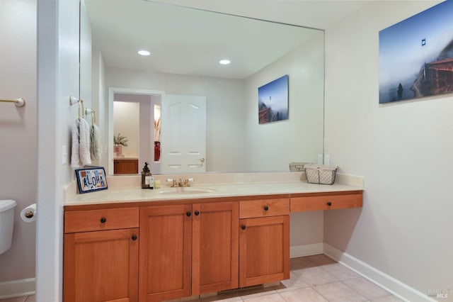 bathroom featuring tile patterned floors, vanity, and toilet