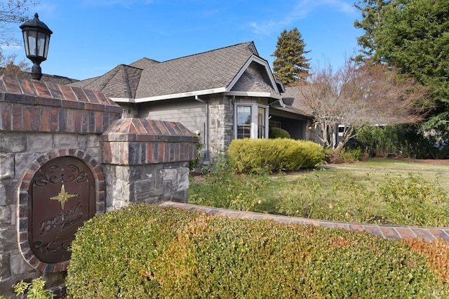 view of home's exterior featuring a yard