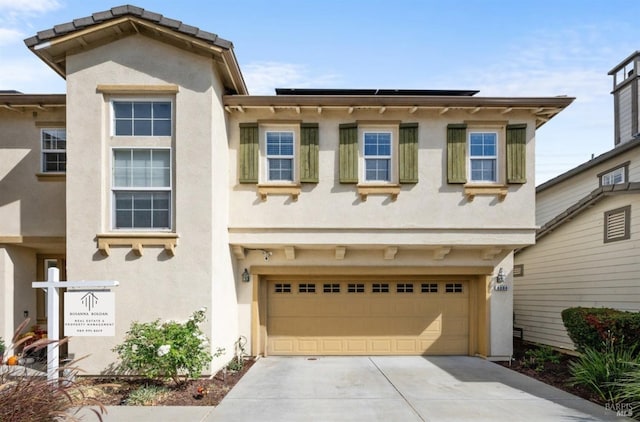 view of front of property featuring a garage