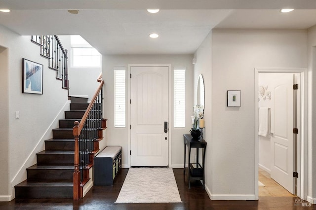 entrance foyer featuring stairway, baseboards, recessed lighting, and dark wood-style flooring