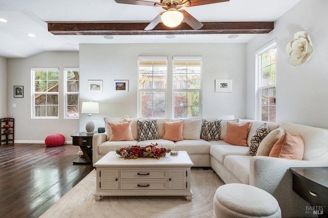 living area with baseboards, beamed ceiling, a ceiling fan, and light wood-style flooring