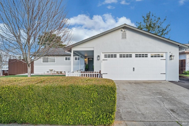 ranch-style house featuring a front lawn and a garage