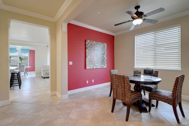 dining room featuring light tile patterned floors, ceiling fan, and ornamental molding