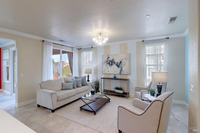 living room featuring crown molding, light tile patterned floors, a chandelier, and a textured ceiling