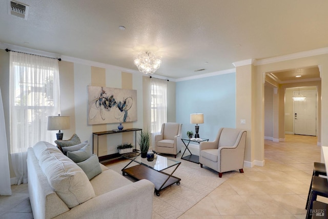 living room featuring crown molding, light tile patterned floors, a chandelier, and a textured ceiling