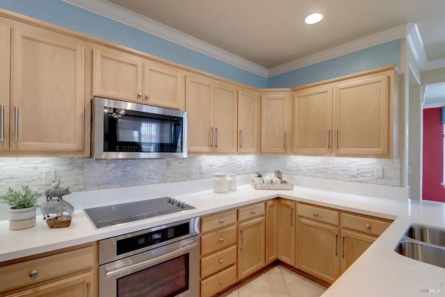 kitchen featuring light brown cabinetry, backsplash, stainless steel appliances, and light tile patterned flooring