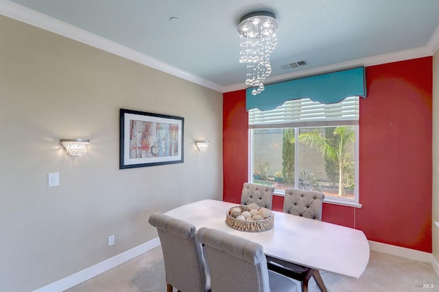 tiled dining room featuring a chandelier and ornamental molding