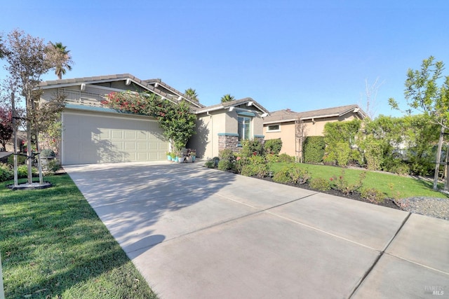 craftsman house featuring a front yard and a garage