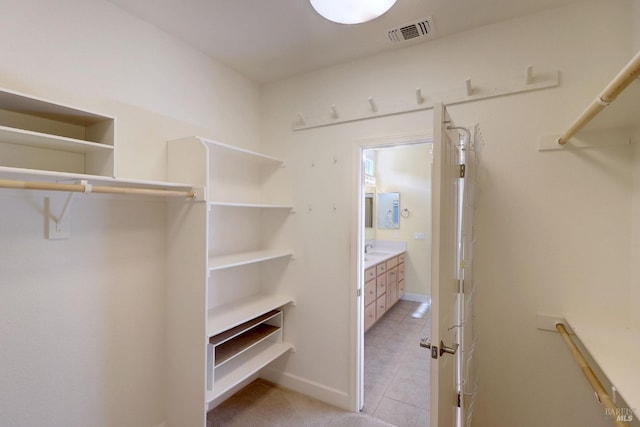 walk in closet with sink